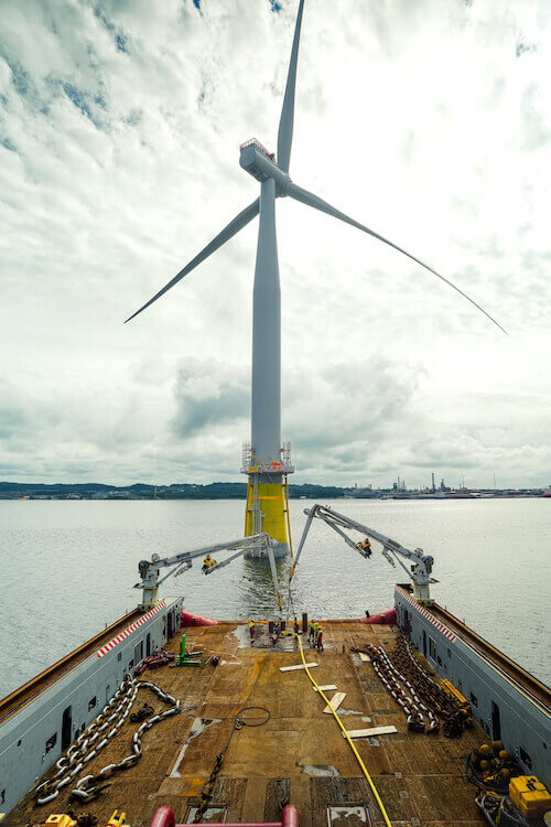 Floating wind turbine being towed out to sea hywind tampen project